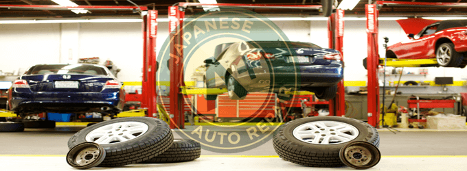 Image of vehicles on our racks - interior of shop - A+ Japanese Auto Repair Inc.